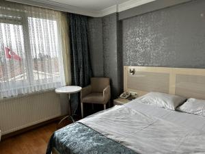 Ένα ή περισσότερα κρεβάτια σε δωμάτιο στο Samsun Park Hotel