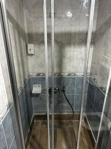 a shower with a glass door in a bathroom at Samsun Park Hotel in Samsun