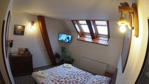 Postel nebo postele na pokoji v ubytování HOTEL BRITANNIA VSETÍN