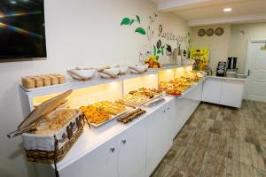 a buffet line with many different types of food at Vander Valk İstanbul Hotel in Istanbul