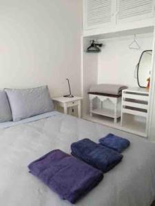 Ένα ή περισσότερα κρεβάτια σε δωμάτιο στο Cosy two bedroom bungalow close to lake and ocean