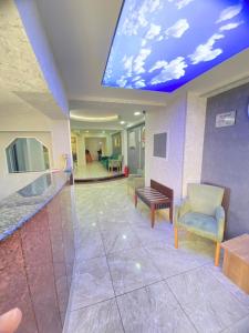 a hospital lobby with a ceiling with a sky at Abam Hotel in Istanbul