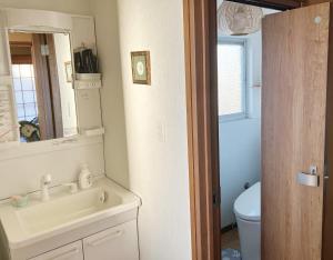 a bathroom with a sink and a toilet at Sakura house in Kyoto