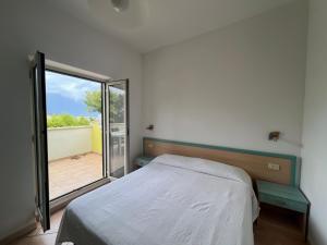 Postel nebo postele na pokoji v ubytování Argeste Club Vacanze + 103 fotografií