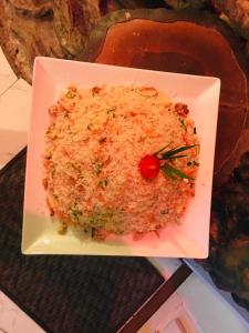 a white plate of rice on a table at Himawari Hills in Nuwara Eliya