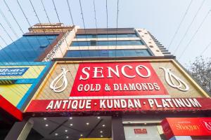 a building with a sign that reads orange gold and diamonds at Super Townhouse 83601 Hotel Marina in Rānchī