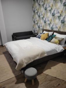 Kama o mga kama sa kuwarto sa AMD UNION Caffe & Rooms