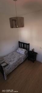 Ein Bett oder Betten in einem Zimmer der Unterkunft SUIT del CAMPO TERIFE