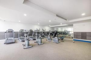 a gym with a large room with cardio equipment at Apartment in Turrella in Sydney