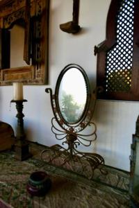 a mirror sitting on a stand in a room at apartment with magnificient Es Vedra view in Cala Vadella