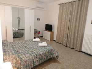 a hotel room with a bed and a television at A casa di Vito in Matera