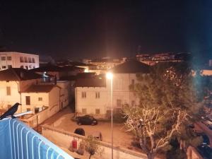 a view of a city at night with a street light at A casa di Vito in Matera