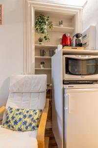 Kuchyň nebo kuchyňský kout v ubytování Résidence du Parc appartement calme
