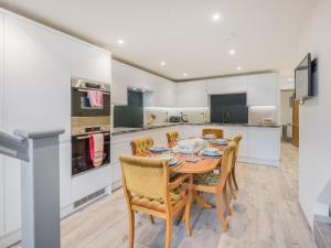 a kitchen and dining room with a table and chairs at 3 Bed in Borrowdale SZ465 in Rosthwaite