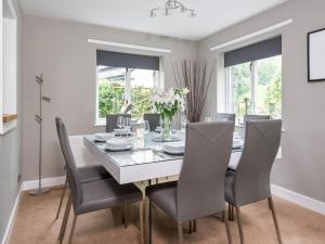 a dining room with a table and chairs at 4 Bed in Borrowdale SZ219 in Grange