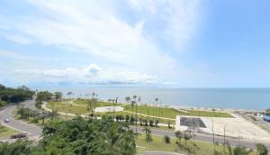 a park with the ocean in the background at Beach apt w/ parking, 24/7 security, tennis court in Libreville