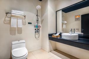 Koupelna v ubytování Boyue Miyazaki Hotel - Guangzhou Baiyun International Airport