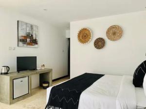 Ένα ή περισσότερα κρεβάτια σε δωμάτιο στο Alami Apartment Seminyak