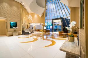 a lobby with a spiral design on the floor at Elite Resort & Spa in Manama