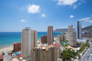 an aerial view of a city with buildings and the ocean at Apartamento Natsu - PlusHolidays in Calpe