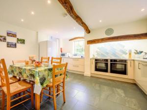 a kitchen and dining room with a table and chairs at 4 Bed in Routenbeck SZ405 in Bassenthwaite Lake