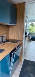 a kitchen with a wooden counter top in a room at Place 2 Beach Next to Ijsselmeer in Lemmer