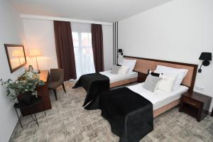 Posteľ alebo postele v izbe v ubytovaní Hotel Focus Centrum Konferencyjne