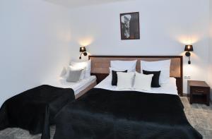Posteľ alebo postele v izbe v ubytovaní Hotel Focus Centrum Konferencyjne