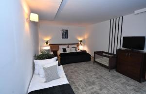 Ένα ή περισσότερα κρεβάτια σε δωμάτιο στο Hotel Focus Centrum Konferencyjne