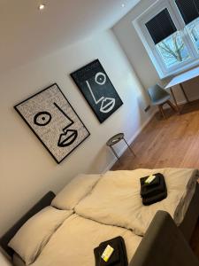 a bed in a room with signs on the wall at Nordstraße 53 in Düsseldorf