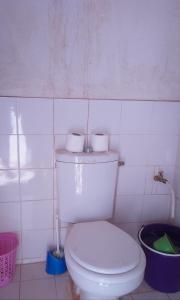 a bathroom with a toilet with two rolls of toilet paper on it at Camp Cheri Beri in Mhamid