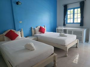March Samui Resort客房内的一张或多张床位