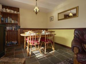 a dining room with a table and chairs at 2 Bed in Wasdale SZ551 in Nether Wasdale