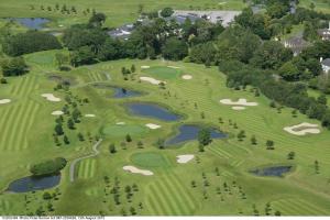 an overhead view of a golf course with ponds and greens at Modern Homestay Rooms Dublin Airport 15 minutes in Ballyboughal