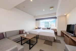 Postel nebo postele na pokoji v ubytování Tokyu Stay Aoyama Premier