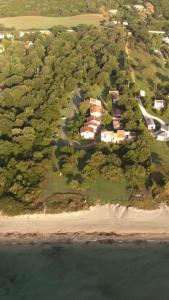 an aerial view of a house on the beach at Residence Scopa Marina in Poggio-Mezzana