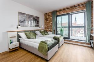 Posteľ alebo postele v izbe v ubytovaní Rent like home - Apartamenty DEO PLAZA + 37 fotografií