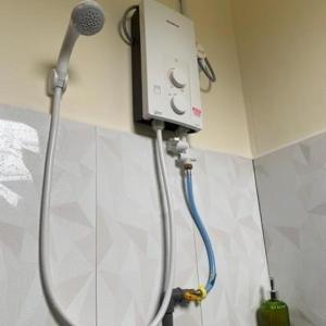 a shower in a bathroom with a blow dryer at chalet gerik in Gerik