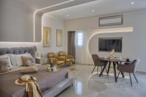 a living room with a couch and a table at Myra Mare Suites by Estia in Amoudara Herakliou
