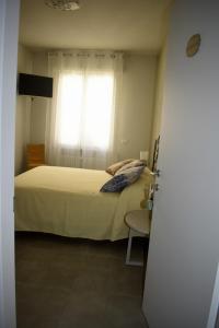 Postel nebo postele na pokoji v ubytování Il Trovatore Rooms