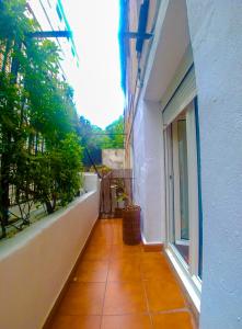 an empty balcony of a building with a window at Donostia, a pocos pasos de la playa de la Concha. in San Sebastián