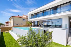 an image of a house with a swimming pool at Luxury Villa Dali with Sauna, Whirlpool and Sea view in Medulin only 1,7 km from the beach in Medulin