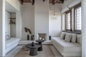 a living room with a couch and a table at Agapitos Villas & Guesthouses in Agios Ioannis Pelio