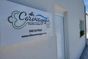 a sign on the side of a building at Villa Caravaggio Comfort e Relax in Rocca San Giovanni