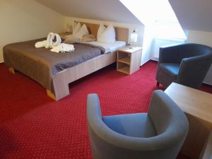 Posteľ alebo postele v izbe v ubytovaní Hotel Džbán