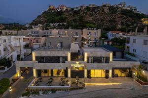 an aerial view of a building in a city at Porto Platanias Village Resort in Plataniás