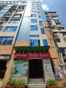 a building with a sign for a hotel holly gate at Hotel Holy Gate in Sylhet