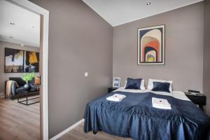 Un pat sau paturi într-o cameră la TA Vervet Apartment Hotel