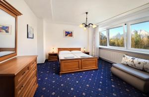 A bed or beds in a room at Hotel Academia