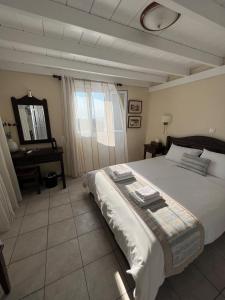 Ένα ή περισσότερα κρεβάτια σε δωμάτιο στο Maria's Place - Adults Only